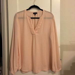 Sheer pink split-neck blouse